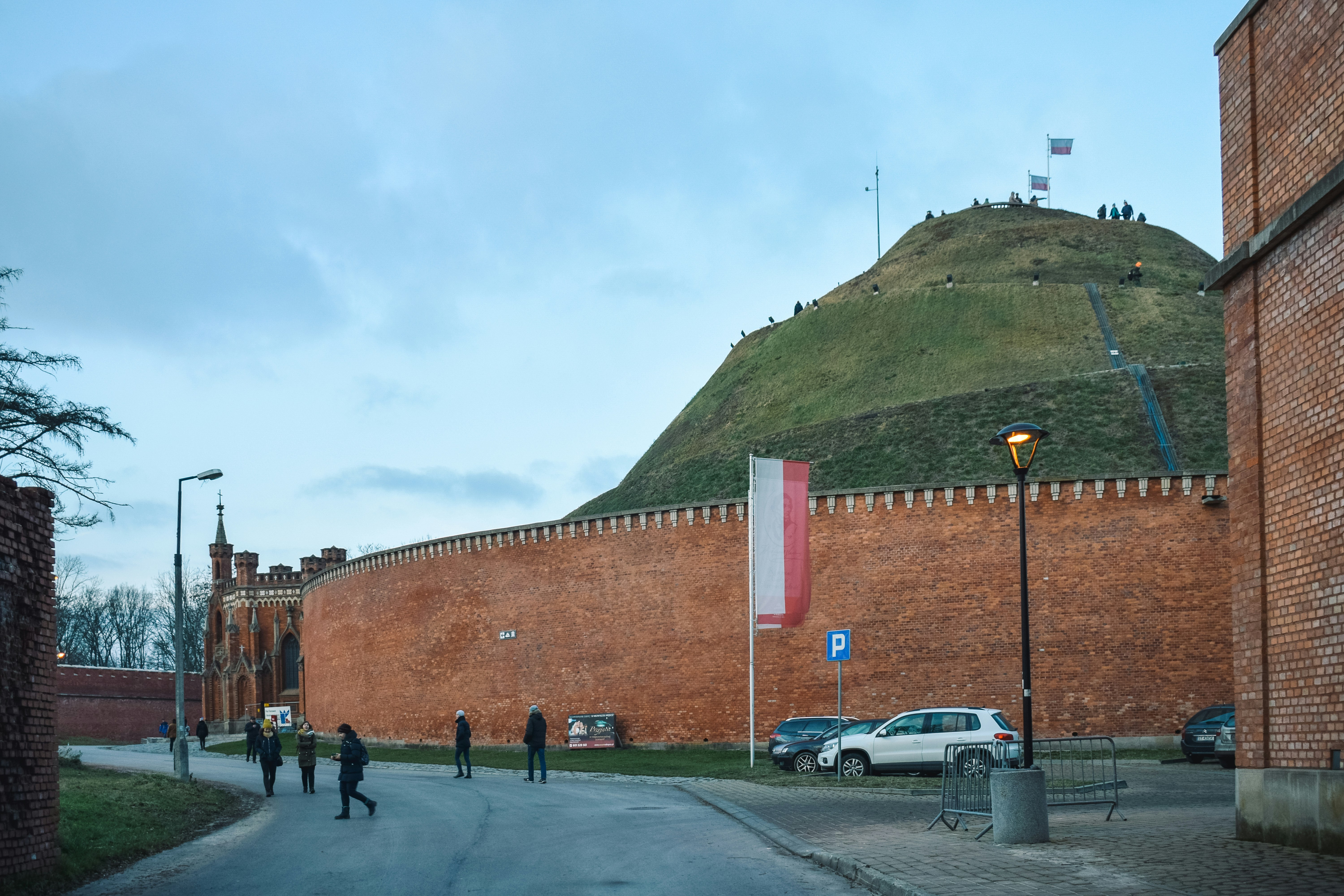 white SUV beside the wall