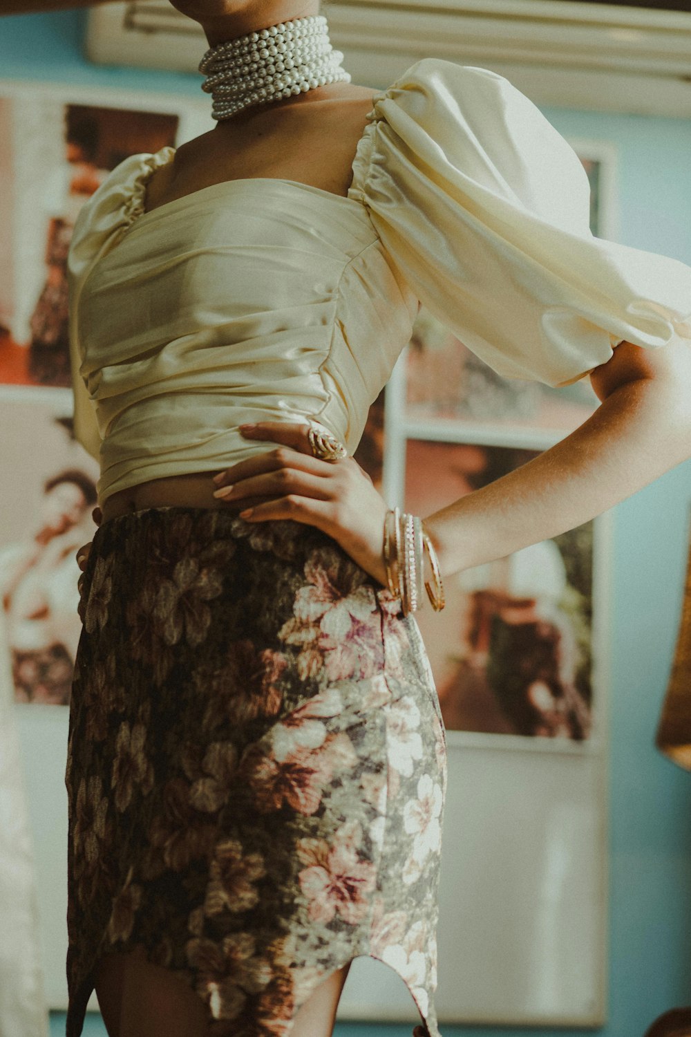 woman in white square-neck crop top and brown and pink floral miniskirt