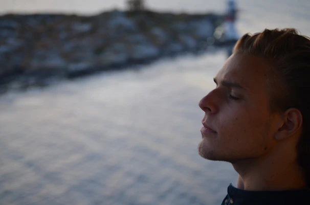 A serene portrait of Jogender Singh meditating outdoors, radiating calm and focus.