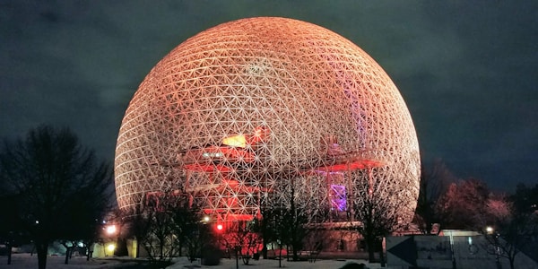 gold sphere landmark at night time