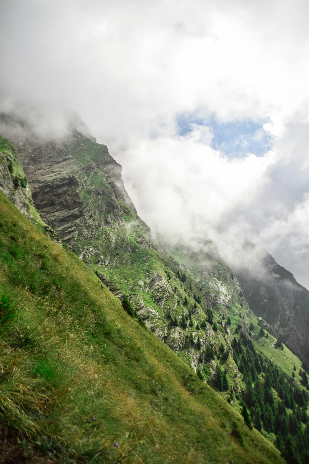 green mountains and white clouds