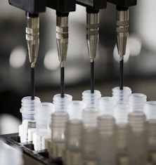 a group of plastic cups sitting on top of a machine