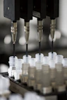 a group of plastic cups sitting on top of a machine