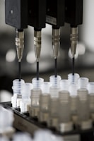 a group of plastic cups sitting on top of a machine