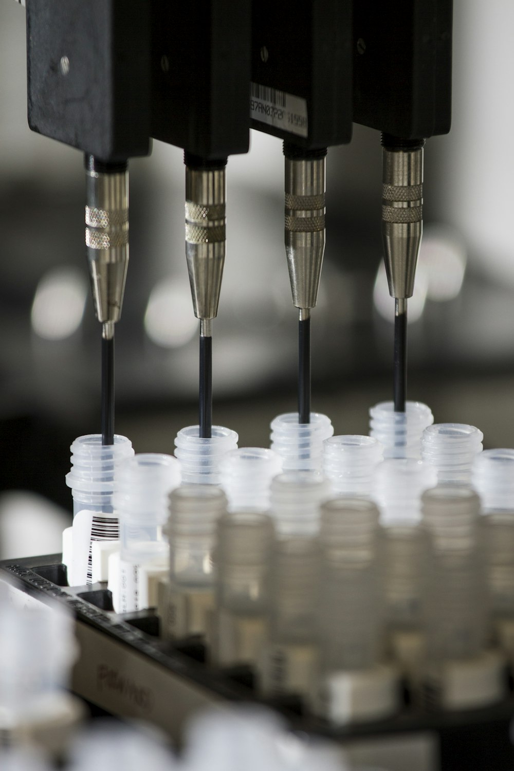 a group of plastic cups sitting on top of a machine