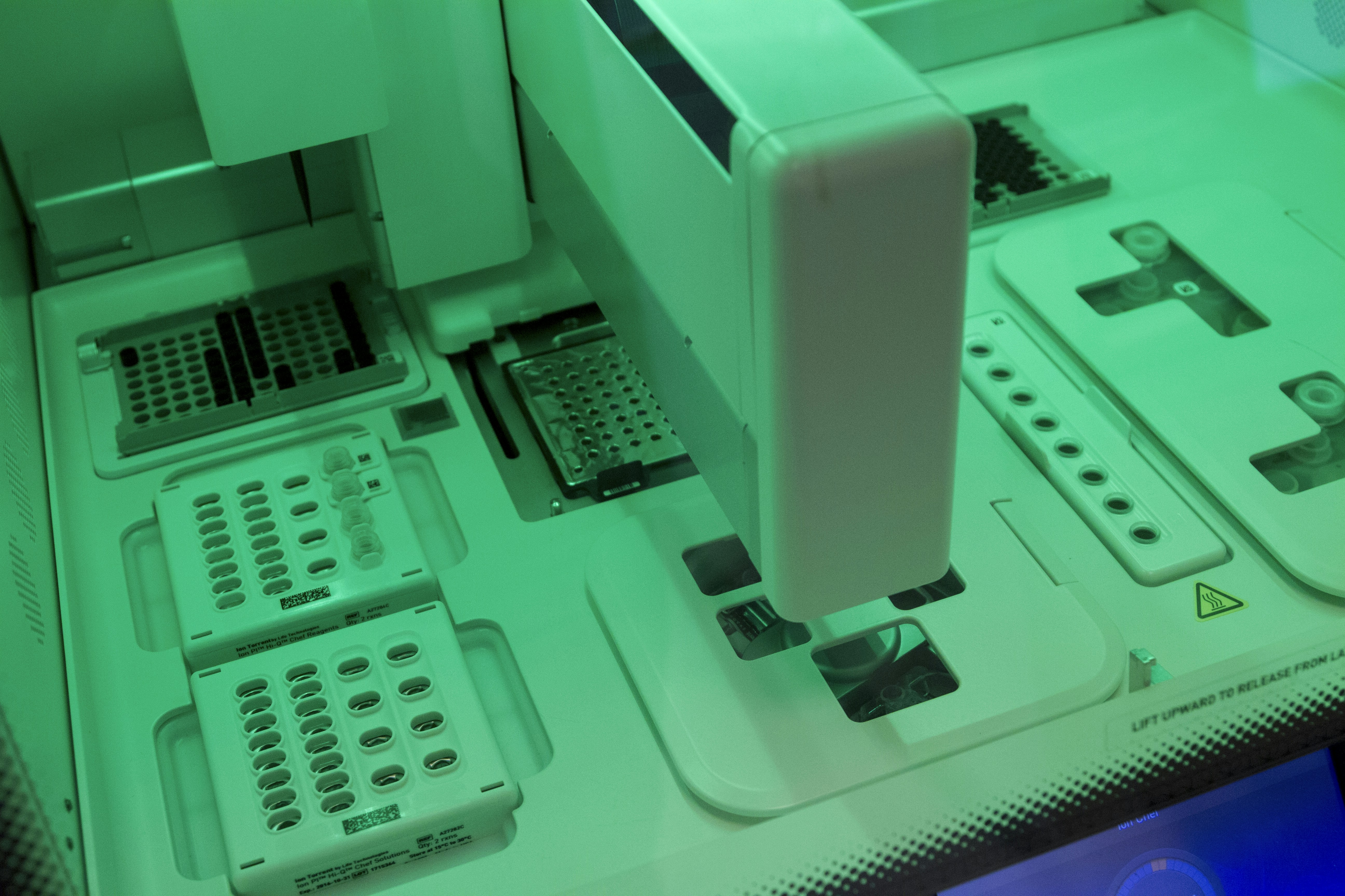 DNA Genotyping and Sequencing. Automated DNA chip loading at the Cancer Genomics Research Laboratory, part of the National Cancer Institute's Division of Cancer Epidemiology and Genetics (DCEG).