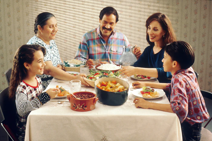 A family enjoying a meal together at the dinner table