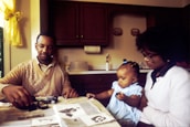 A happy family using energy-efficient appliances at home, highlighting cost savings.