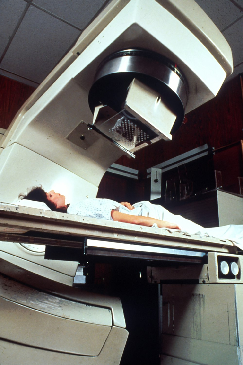 woman lying on machine bed