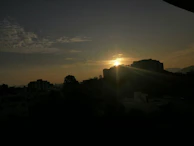 A scenic sunrise over a quiet cityscape, symbolizing new ideas and fresh starts.