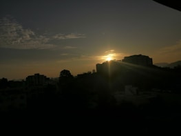 A scenic shot of a sunrise over a city skyline, illustrating photography tips.