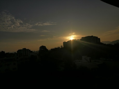 A vibrant sunrise over an African city skyline symbolizing new opportunities and growth.