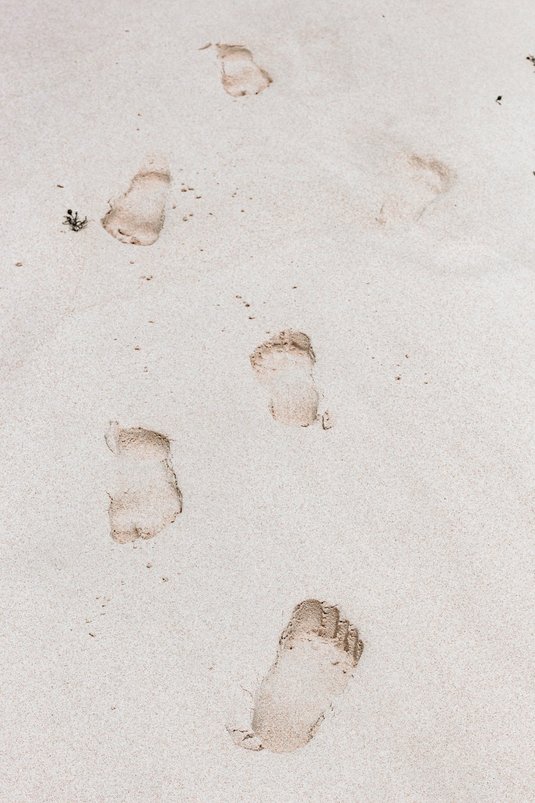footprints on white sand