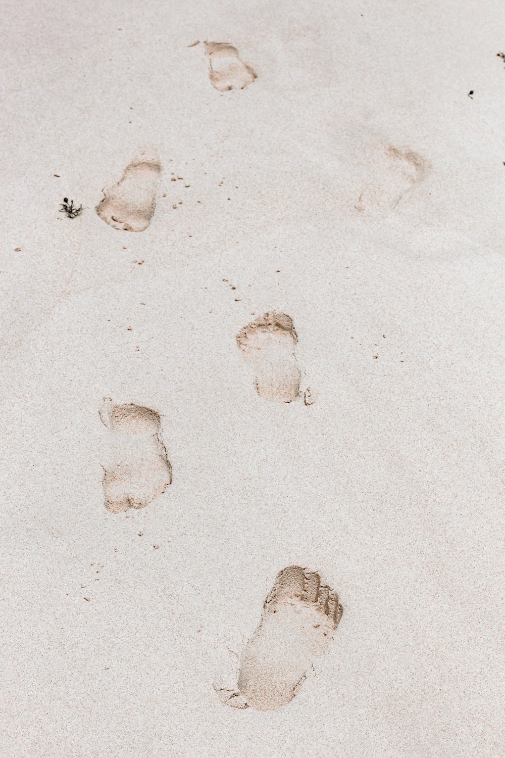 footprints on white sand