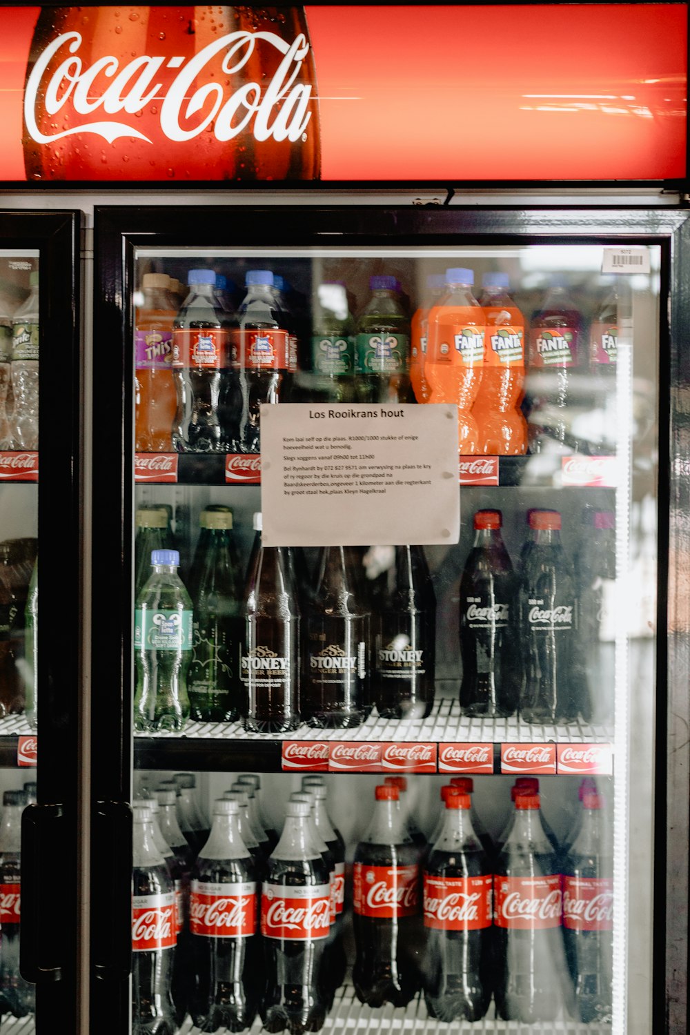soda bottle inside commercial refrigerator