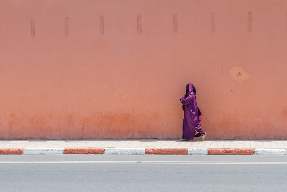 woman wearing purple silk abaya