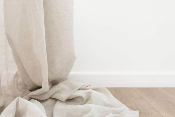 Elegant curtains draping gracefully in a minimalistic home setting.