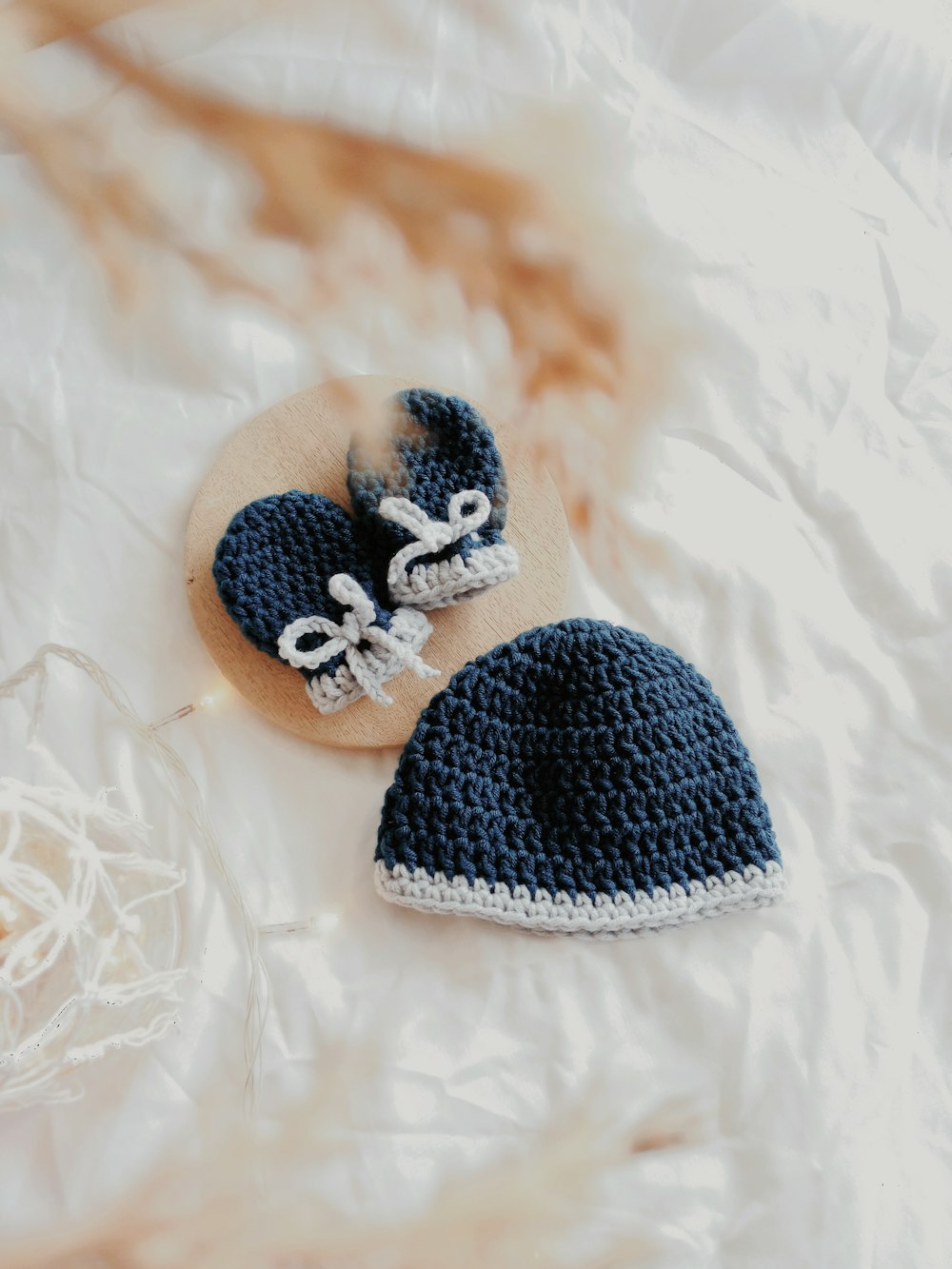 babys black knit cap and gloves