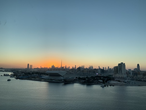City skyline at sunset highlighting high-rise real estate developments.