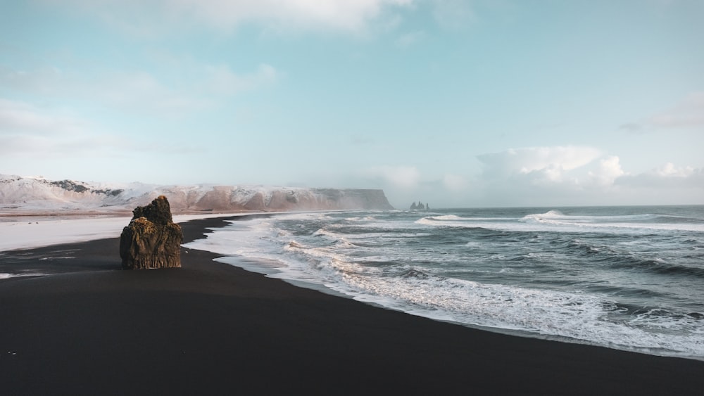 rock formation in front of beachline