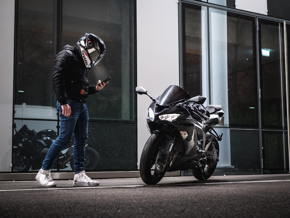 man standing in front of sportbike