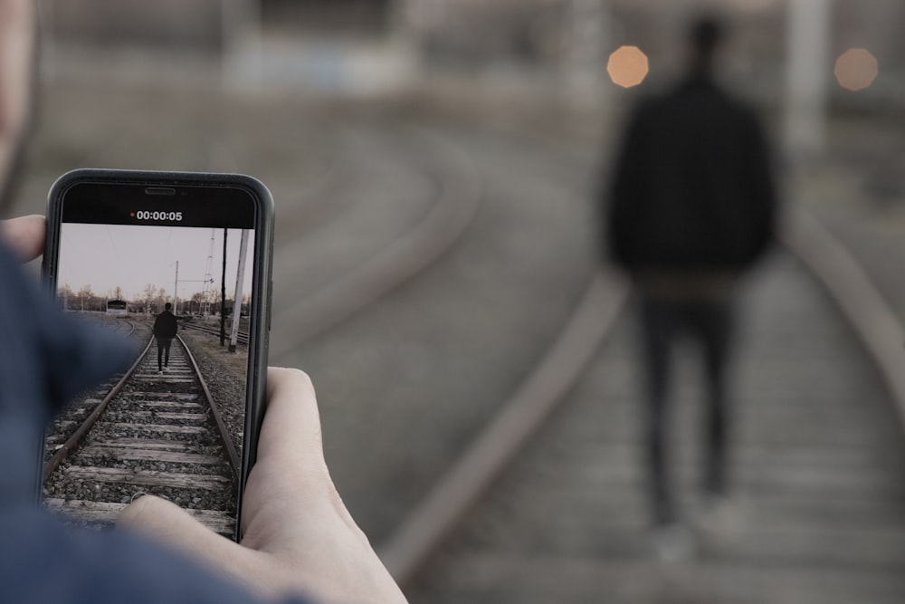 unknown person using smartphone outdoors