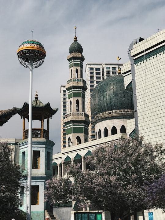 green and white concrete dome building in Xining Dongguan Grand Mosque China