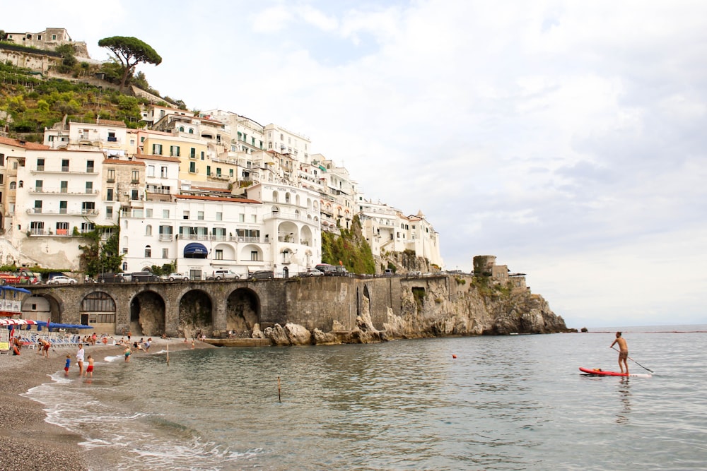 man paddling on shore