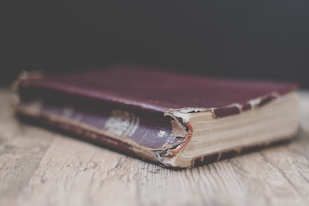 book on brown surface