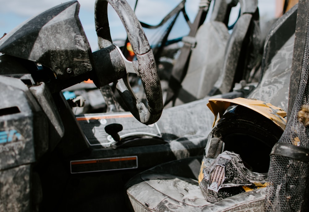 black and yellow full-face helmet on black vehicle chair