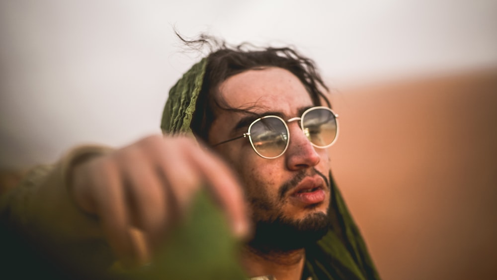 man wearing grey frame sunglasses