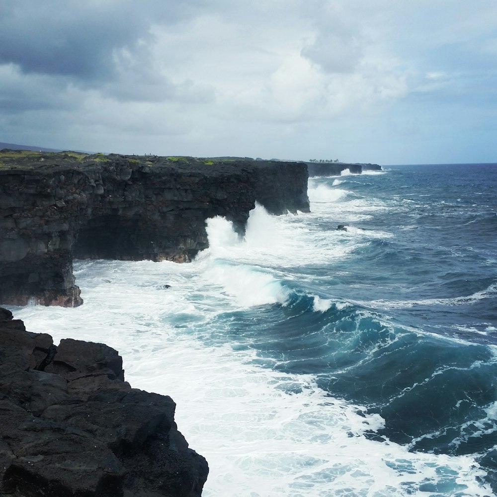 waves crashing on stone