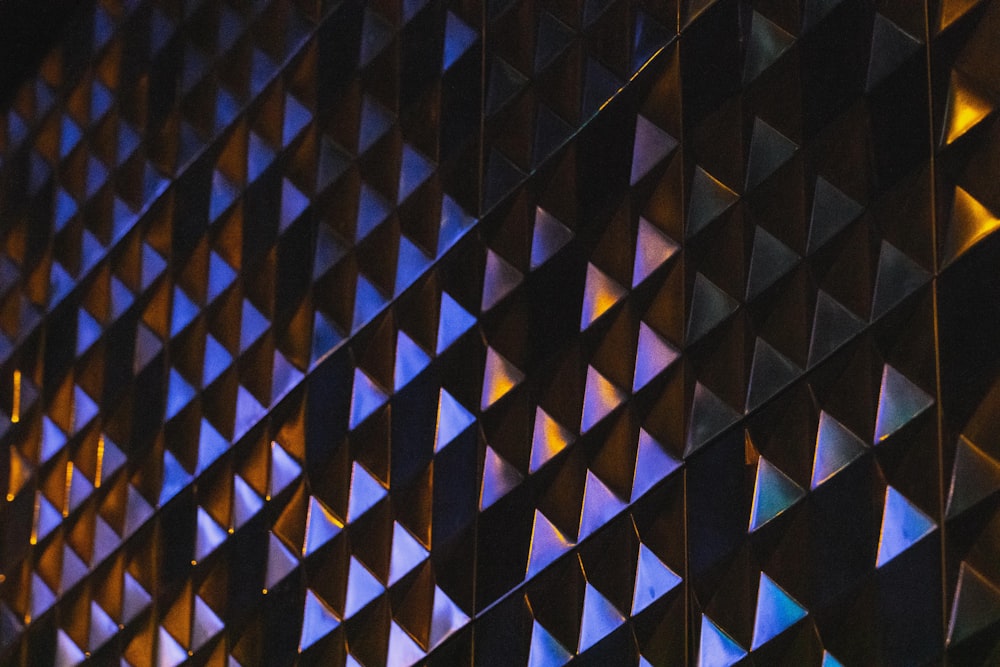 a close up of a wall made of triangles