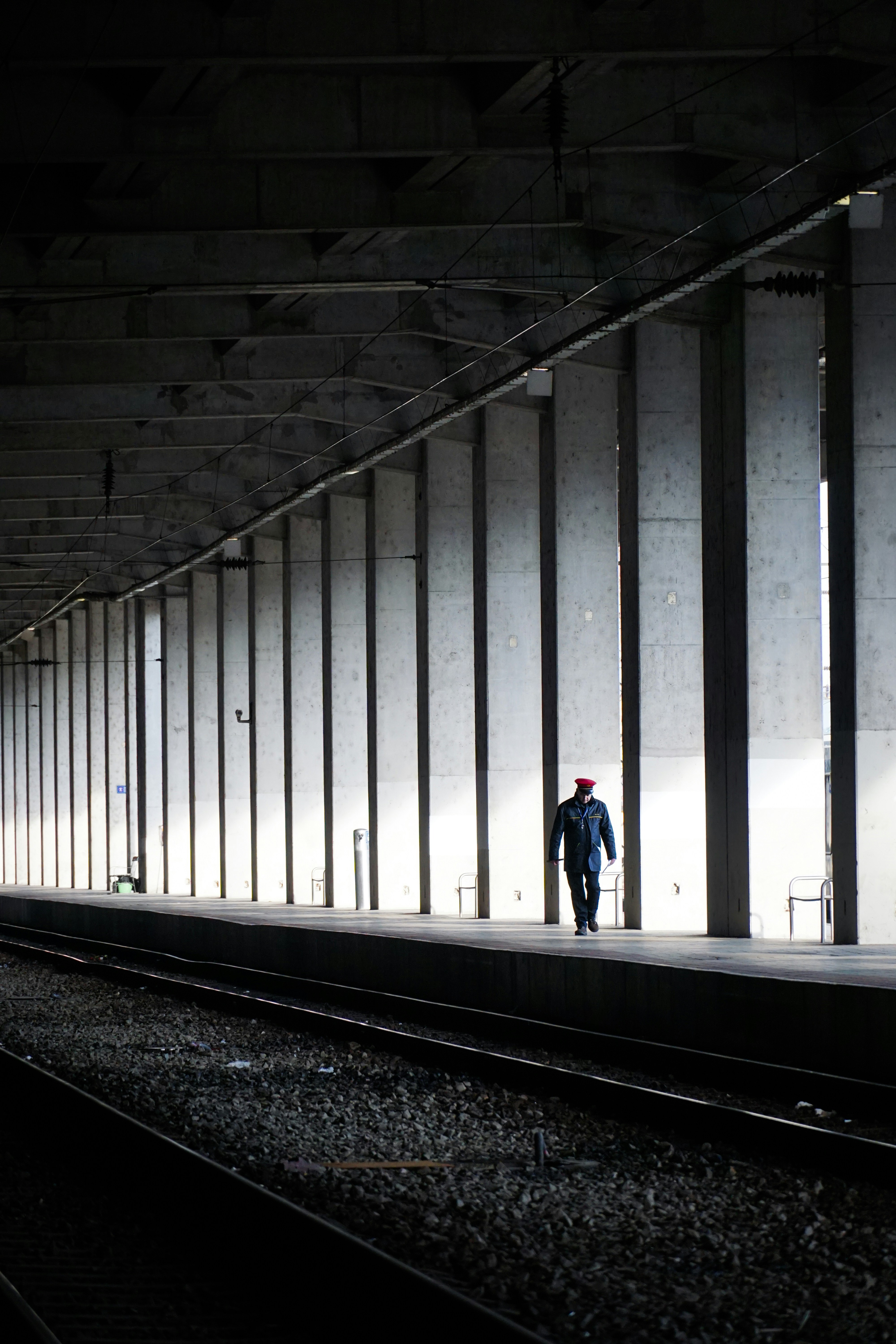 2 person walking on train station