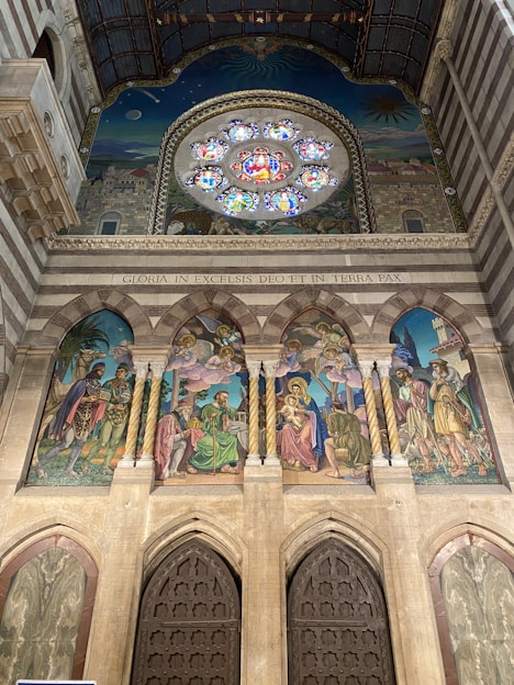 A large mural painting depicting a vivid sky with poetic and emotional tones inside a church.