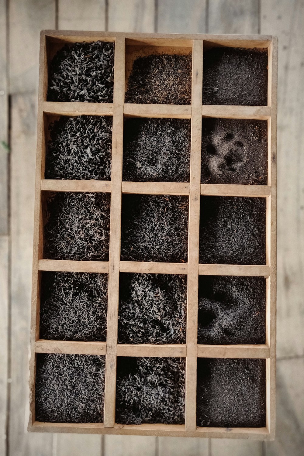 sands on brown wooden box