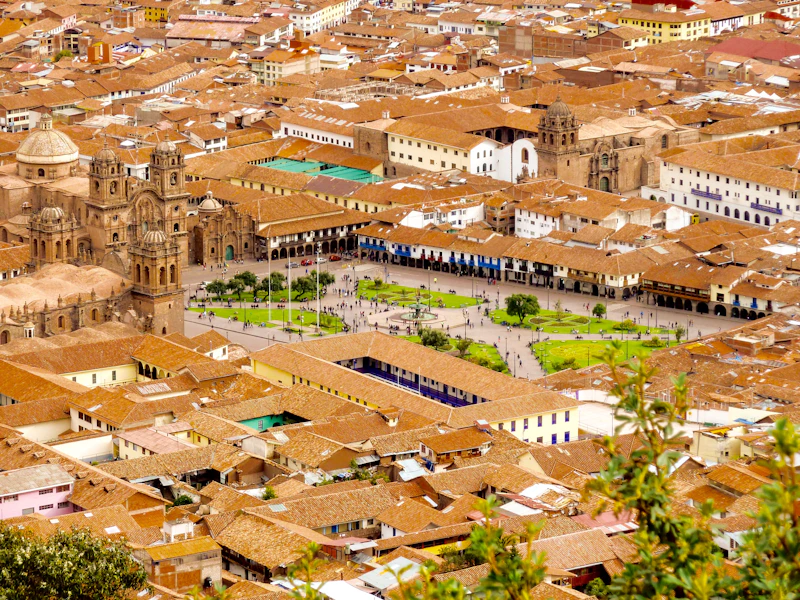 Cusco's Plaza de Armas with its cathedral and flags