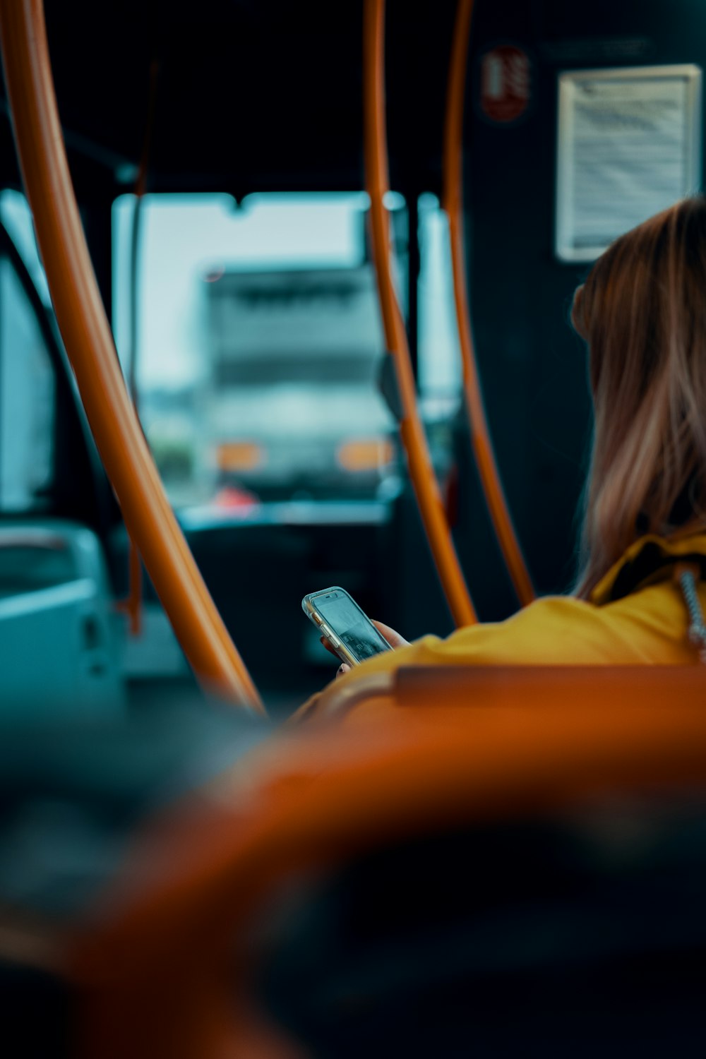 person holding smartphone inside room