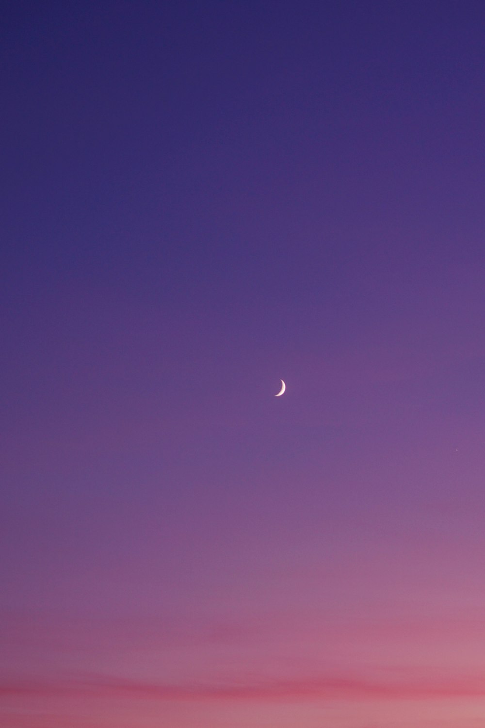 half moon during sunset