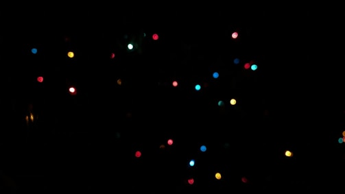 A collection of colorful party lights illuminating a dance floor.