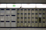 Rows of storage lockers with clear signage and well-lit corridors.