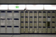 Modern locker units for employee use in a clean, organized changing area.