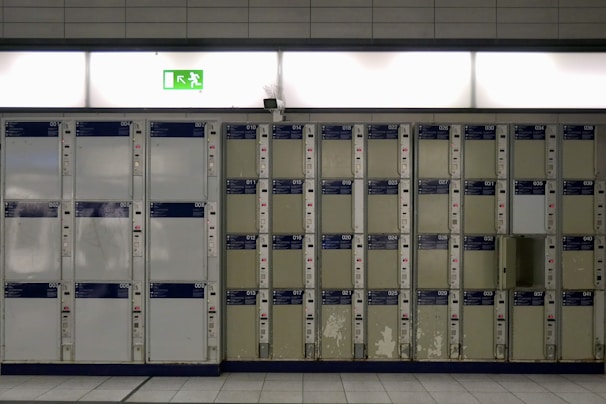 Row of metal lockers in a hospital changing area, clean and organized