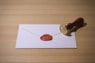 white envelope with brown stamp