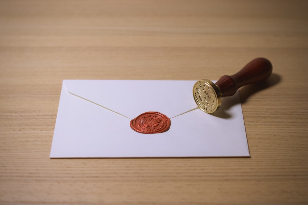 white envelope with brown stamp
