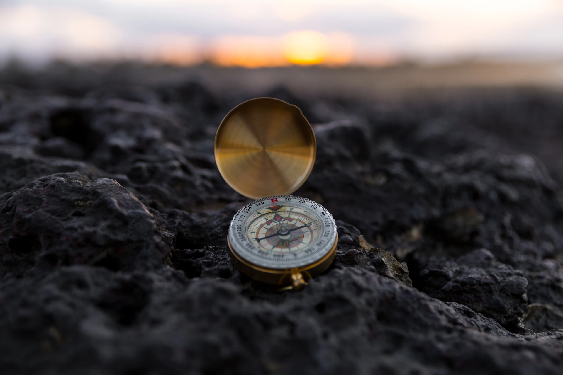 round gold-colored compass