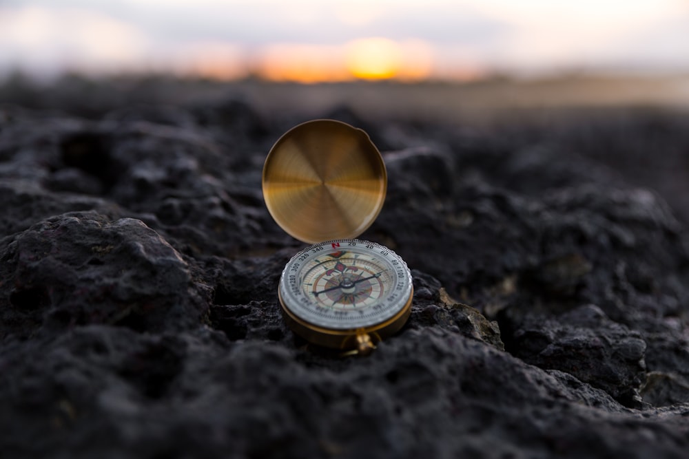 round gold-colored compass