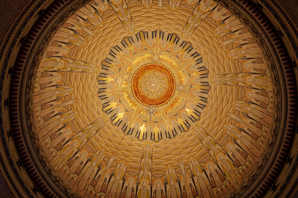 the ceiling of a building with a circular design