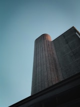 a tall building with a blue sky in the background