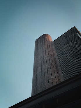 a tall building with a blue sky in the background